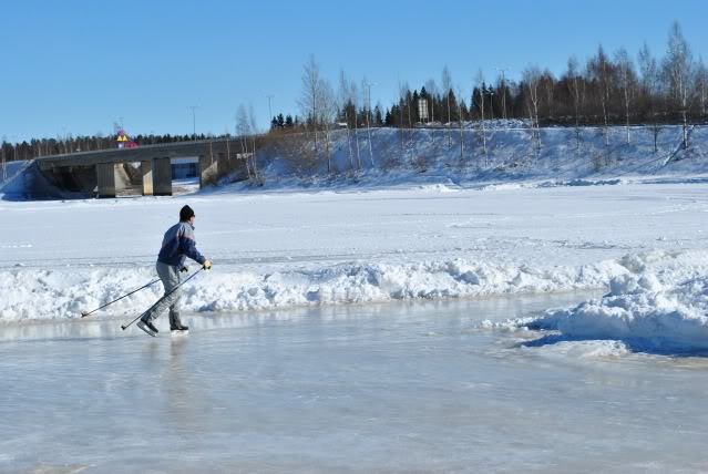 Men skating on ice in Finland.